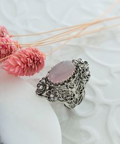 Rose Quartz Silver Oval Floral Statement Ring, 925 Sterling Artisan Made Handcrafted Flower Filigree Cocktail Ring Handmade Women Jewelry Pink stone ring, floral ring, flower basket ring, vintage ring, anniversary gift, birthday gift Material: 925 Sterling Silver (NICKEL FREE) Gemstone: Rose Quartz 10x14 mm. FREE, FAST AND TRACKABLE SHIPPING FOR ALL EU COUNTRIES AND USA. COMES WİTH VELVET POUCH AND LUXURY GİFT BOX. Show off this gorgeous ring at any occasion. This eye catching elongated oval sta Silver Oval Flower Ring For Wedding, Unique Oval Filigree Wedding Ring, Bohemian Oval Rings With Intricate Design, Bohemian Oval Filigree Ring With Intricate Design, Bohemian Oval Filigree Ring With Gemstone, Unique Silver Oval Flower Ring, Handmade Silver Oval Flower Ring, Handmade Ornate Rings, Oval Silver Filigree Ring Bohemian Style