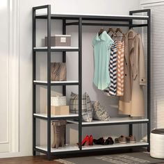 an organized closet with clothes and shoes on shelves in front of a white painted wall