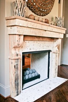 a fireplace in a living room filled with lots of furniture and decor on top of it