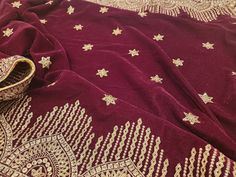 An authentic handmade velvet shawl with a stunning mulberry colour. It is made of premium lightweight velvet fabric that will not disappoint. Adding to its beauty is the gold embroidery work and subtle bead design. Our velvet shawls are very popular and finish quickly. These are while stocks last. You will find similar products on other shops, however, you will not find the same quality as ours. We absolutely stand by our products and will be here to support you along your whole shopping journey. You can also find us on Instagram @AfghanWeddingThingss Feel free to send any inquiries about any of our products.  Dimensions: 237cm x 83cm Elegant Gold Velvet Traditional Wear, Festive Velvet Dupatta With Pallu, Semi-stitched Velvet Dupatta With Pallu, Traditional Velvet Saree For Festivals, Velvet Dupatta With Pallu For Eid, Bollywood Style Velvet Dupatta For Diwali, Bollywood Velvet Dupatta For Diwali, Velvet Saree With Pallu For Wedding, Traditional Velvet Saree