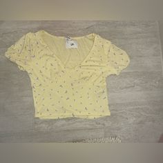 Brand:Cotton On Size:Small Color:Yellow With Purple Flowers Condition:New With Tags Never Worn Trendy Summer Tops With Lemon Print, Casual Lemon Print Tops For Spring, Cute Yellow Summer Tops, Cute Fitted Yellow Tops, Spring Lemon Print Short Sleeve Tops, Summer Short Sleeve Top With Lemon Print, Casual Yellow Tops With Lemon Print, Summer Yellow Top With Lemon Print, Yellow Lemon Print Top For Summer