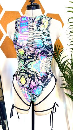 How will you style this rainbow trippy bodysuit? Featuring pre-cut slits and attached leg wraps, this rave bodysuit is a unique music festival outfit wrapped into one piece. Rave Bodysuit, Leg Wraps, Leg Straps, Music Festival Outfit, Rave Outfit, Rave Outfits, Festival Outfit, Music Festival, One Piece