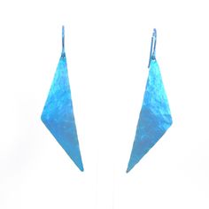 "These one-of-a kind two inch long geometric triangle dangle earrings are handmade from pure grade 1 titanium. They have been hammered for texture and anodized a beautiful blue with matching ear wires. For your nickel free ear wires, choose either niobium (for extra sensitive ears) or pure titanium from the drop-down menu. These earrings are very lightweight and hypoallergenic, making them comfortable for anyone to wear. For information about anodizing, see the last photo (click photo to enlarge for easier reading). * Pure grade 1 titanium anodized blue * Pure grade 1 titanium ear wires * Niobium ear wire option (drop down menu) * Earring drop length 2 1/4\", width 1/2\" * Lightweight * Nickel free Pure titanium is considered the most hypoallergenic of all metals. It is commonly used in su Blue Hammered Drop Earrings, Blue Triangle Earrings For Gift, Blue Hammered Earrings For Gift, Modern Blue Geometric Earrings, Extreme Metal, Jewelry Cleaning Solution, Titanium Earrings, Titanium Jewelry, Click Photo