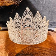 925 Sterling Silver big Filigree Bridal Crown, turkish telkari openwork jewellery, luxury Mardin jewelry. IF YOU WANT THIS PRODUCT GOLD-PLATED PLEASE SEE VARIATIONS. * Material: 925 Sterling Silver. * Weight: 140 grams. * Width: 39 cm. * Height: 10 cm. IMPORTANT: * Our products are 100% handmade and can personalized. * Because this is a handicraft our shipping time takes 10 working days. * The product is sent with a gift box. * Free shipping worldwide * Delivery time: Depends on the recipient's country Elegant Ceremonial Crown Headpieces, Elegant Ceremonial Headpiece With Pinched Crown, White Crown Headpieces As Gift, Wedding Jewelry With High Crown And Crown Design, Elegant Handmade Ceremonial Headpieces, Elegant Ceremonial Handmade Headpieces, Elegant Silver Teardrop Crown Headpiece, Elegant Silver Headpiece With Teardrop Crown, Elegant Silver Headpiece With Structured Crown