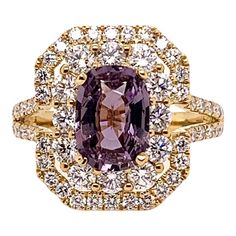 This unique ring has a very unusual center stone. It is a GIA certified, unheated natural purple sapphire that weighs 2.06 carats. The soft purple hue is complemented by the 1.58 carats of round brilliant diamonds and set in the 18k yellow gold. This delightful combination is an eye pleaser! Ring Size: 6.5 & can be sized One of a kind, cannot be reproduced. Purple Sapphire Ring, Purple Stone Rings, Purple Ring, Saphir Ring, Purple Rings, Purple Diamond, Gold Solitaire Ring, Purple Sapphire, Platinum Engagement Rings