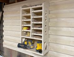 a wooden shelf filled with lots of tools