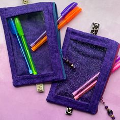 These fabric pouches measure approximately 7.5 x 4.5 inches and have a clear portion on the front so you can easily view items inside, such as pens, pencils, sticky notes, sticker sheets, washi tape and more! Accessories pictured do not come with the purchase of the pouch. They fit on a notebook/planner that is about 9-10.5 inches tall and 1-2 inches thick. Please send me a message if you have any questions! Option 1) has clear vinyl and a smooth studded elastic band.  Option 2) has clear glitte Purple Pencil Case With Pen Holders As Gift, Purple Pencil Case With Pen Slots As Gift, Gift Purple Pencil Case With Pen Holders, Purple Zipper Pouch Pencil Case For School, Purple Pencil Case With Pen Holders For Daily Use, Purple Stationery With Pen Holders As Gift, Purple Pouch Pencil Case For School, Rectangular Purple Pencil Case, Purple Rectangular Stationery Gift