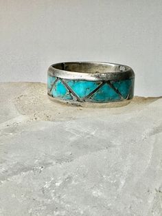 "Zuni ring Turquoise wedding band size 6.50 sterling silver women men Size  6.50 Weight  4.1g  Width   1/4\" Free Shipping & Free/4 Postal Insurance  Delivered in a Gift Box  Free First Class shipping and postal insurance is included. If you want to upgrade to priority kindly pay an additional fee to do so.  This is recommended if you would like to have your package delivered faster than first class which has slowed down" Round Patina Rings For Anniversary, Turquoise Toe Ring Jewelry For Anniversary, Turquoise Vintage Promise Ring, Turquoise Round Band Ring For Anniversary, Vintage Turquoise Promise Ring, Unique Stackable Turquoise Ring For Anniversary, Silver Stackable Turquoise Ring For Anniversary, Silver Patina Jewelry For Weddings, Silver Southwestern Style Wedding Ring