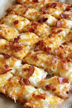 the pizza is covered with cheese and bacon