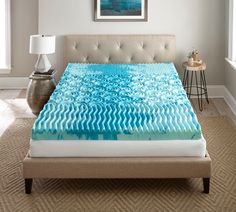 an image of a bed with blue waves on it