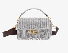 Iconic medium Baguette bag made of soft, green wool and decorated with an FF clasp. Featuring a front flap with long fringes, magnetic clasp, internal compartment lined in FF fabric and with a zipper pocket, and gold-finish metalware.The bag can be carried by hand, or worn either on the shoulder or cross-body thanks to the tone on tone leather shoulder strap and handle, both detachable.Made in Italy Long Fringes, Baguette Bag, Green Wool, Hermes Bags, Timeless Handbag, Magnetic Clasp, Fendi Bags, Black Handbags, Prada Bag