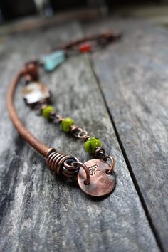 Earthy and organic copper/leather necklace where every bead is the focus.  Beautiful with scarves, layered with more like pieces and also great all alone for I wear mine just as it is :)   So comfortable! Some of the steps involved: wrapping, tumbling, attaching, oxidizing and then finishing up with sanding away the high points to give expression of detail. 22 inches long enjoy,   Stephanie www.stephaniedistler.com Serpentine Necklace, Clasp Necklace, Jewelry Techniques, Petrified Wood, Leather Necklace, Leather Jewelry, Wire Wrapped Jewelry, Artisan Jewelry, Wire Jewelry