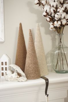 three different types of cotton cones on a mantle