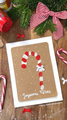 a homemade christmas card with candy canes and candies