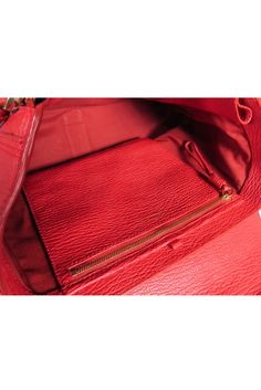 Unleash your inner fashionista with the 3.1 Phillip Lim red leather "Pashli" satchel bag. This structured handbag features bold red leather and gold hardware for a statement-making look. With its versatile crossbody strap, it's the perfect addition to any wardrobe in need of a pop of color. 100% Leather Gold lock front closure Two front zipper details One interior zipper pocket Detachable and adjustable long strap Comes with dustbag Minor scratches on front closure Height 10.5" Width 13" Depth 4 Red Leather-lined Shoulder Bag For Office, Designer Red Satchel For Everyday, Red Leather Satchel With Zipper Closure, Red Double Handle Satchel For Business, Red Crossbody Satchel For Business, Red Leather Briefcase With Top Handle, Red Leather Briefcase With Top Carry Handle, Luxury Red Bags With Zipper Closure, Red Shoulder Bag Style Briefcase