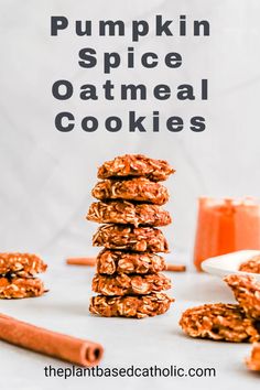 pumpkin spice oatmeal cookies stacked on top of each other with cinnamon sticks