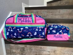 "Rainbow Duffel and Toiletry Bag DESCRIPTION: Who's ready for an adventure?! With our duffel bags your kiddo will be ready for anything. Designed with an inner zipper pocket and outer velcro pocket to keep you organized and the essentials accessible. We added a removable and adjustable shoulder strap, so you wont need to purchase a new bag as your little traveler grows. Pair with our new Toiletry Bag and you will be ready to rock and roll. Bon Voyage! Included with this duffle is a personalized Cute Rectangular Bags For Outdoor Activities, Fun Multicolor Bags For Outdoor Activities, Playful Customizable Bags For Travel, Multicolor Duffle Bag With Removable Pouch For Travel, Zipper Closure Duffle Bag For On-the-go, Nylon Duffle Bag With Adjustable Strap For On-the-go, Nylon Duffle Bag With Zipper Pocket For On-the-go, Wet Dry Bag, Travel Duffle Bag With Large Capacity, Multicolor