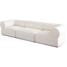 a white couch sitting on top of a white floor