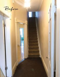 an empty hallway with stairs leading up to the door