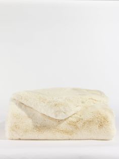 a white blanket on top of a table