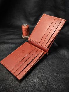 "Dear Visitor; As you see in these pictures ;You will see two types of money clip wallets. One is a single color model and the other is a double color model. You can specify the leather color combinations you want to use in your message. I can type few characters (2-3) like your initials. It is suitable for formal and casual occasions.                                                          My wallets are  made from vegetable tanned leather which is produced by https://www.sepici.com.tr/ I don't work with faux leather at all. My wallets don't have any foul or sharp smell because I reject to use any aggressive chemicals / glues which is not safe for me in the first place. My method is old style. All items and all parts are %100 handmade (cutting, painting, stitching and burnishing). No ele Classic Bifold Coin Purse With Card Slots, Handmade Classic Wallet, Classic Trifold Coin Purse, Traditional Brown Wallet For Gift, Traditional Brown Wallets For Gifts, Traditional Brown Wallets As Gifts, Classic Hand-stitched Wallets As Gifts, Handmade Classic Trifold Wallets, Classic Bifold Coin Purse For Gift