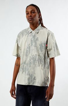 The Uprising Woven Camp Shirt from LOST offers a timeless style with its straight hem, classic collar, and button closure. Made from soft cotton, it features an all-over print, a left chest pocket with a woven flag label, and a center back pleat at the yoke for added detail.Straight hemClassic collarButton closureWoven flag label at pocketCenter back pleat at yokeAll over printedLeft chest pocket100% CottonMachine washableModel is wearing size mediumModel Measurements: 6'1â Height, 29.5" Waist, 32â Hips, 32â Inseam LOST Mens Uprising Woven Camp Shirt - Green size Large Casual Shirt With All Over Print And Spread Collar, Relaxed Fit Camp Shirt With All Over Print, Casual Spread Collar Shirt With All Over Print, Casual Shirt With Graphic Print And Spread Collar, Cotton Short Sleeve Collared Shirt With All Over Print, Casual Cotton Shirt With All Over Print, Cotton Short Sleeve Shirt With All Over Print, Spring Cotton Camp Shirt With All Over Print, Collared Cotton Shirt With All Over Print