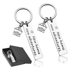 two key chains that say i love you to the moon and back with a house on it