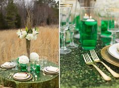 the table is set with green and white plates, silverware, and flowers in vases