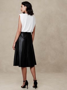 Vegan Leather Midi Skirt | Banana Republic Factory Sleek Knee-length Leather Skirt, Chic Leather Pleated Skirt, Classic Knee-length Leather Skirt, Knee-length Leather Bottoms For Formal Occasions, Chic Knee-length Faux Leather Skirt, Sleek Leather Midi Skirt, Leather Midi Skirt For Office, Classic Knee-length Leather Bottoms, Workwear Leather Pleated Skirt