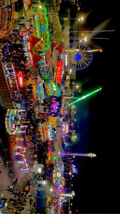 an aerial view of a carnival at night