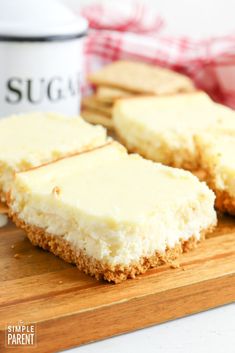 three pieces of cheesecake on a cutting board