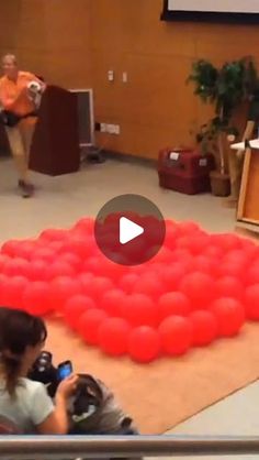 a woman taking a photo of an inflatable ballon mattress on the floor