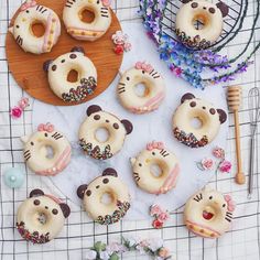 donuts decorated with hello kitty icing and sprinkles on a table