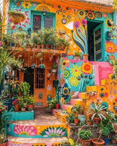 colorfully painted steps leading up to a building with potted plants on each step