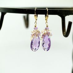 "Pink Amethyst, Rose Quartz and Ethiopian Opal Gemstone Earrings in Gold Filled. Stunning large Pink Amethyst briolettes, wrapped with high quality 14k gold filled wire, suspended from a cluster of shimmering Opal, Pink Amethyst and Rose Quartz beads. These are the best quality Pink Amethyst gems I have seen, transparent with a warm and uniform color - really unique and one of a kind! Light, dangly, shimmering feminine, chic statement earrings, perfect for special occasion, wedding, holidays or Elegant Lavender Earrings With Ear Wire, Elegant Lavender Earrings With Gemstone Accents, Briolette Gemstone Earrings For Wedding, Amethyst Earrings With Gemstone Accents For Wedding, Amethyst Gemstone Earrings For Wedding, Amethyst Gemstone Wedding Earrings, Wedding Amethyst Earrings With Gemstone Accents, Wedding Earrings With Amethyst And Gemstone Accents, Fine Jewelry Faceted Wedding Earrings