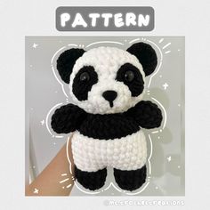 a crocheted panda bear with black and white stripes on it's chest