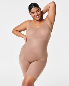 Feels like nothing, does everything.® Experience lightweight and powerful compression with our SPANXshape™ Invisible Mid-Thigh Bodysuit. Featuring advanced single-layer Printed Power® shaping technology made with LYCRA® FitSense™ Print Technology, this bodysuit includes targeted tummy control panels that wrap around for 360-degree shaping and full body control. Designed with ultra-thin, breathable fabric that is moisture-wicking and quick-drying, an open gusset for ease, adjustable straps that e Best Shapewear, Shaping Bodysuit, Thigh Chafing, Control Panels, Shapewear Bodysuit, Women's Shapewear, Wearing Dress, Wrap Around, Shapewear