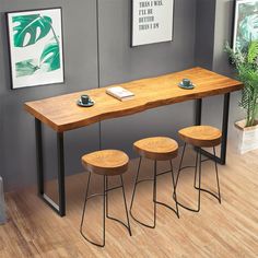 three stools and a table in a room