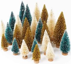 small christmas trees are lined up in rows