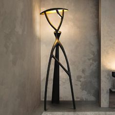 a lamp that is next to a wall