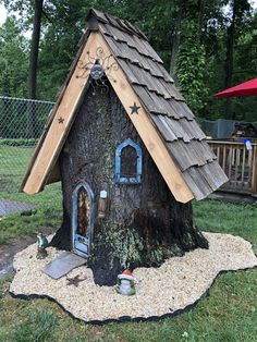 a tree house made out of a log