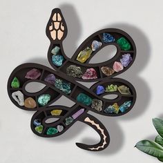 a decorative snake made out of various stones