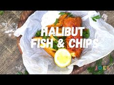 fish and chips in a basket with the words halibut fish & chips