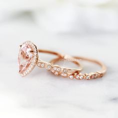 Beautiful Vintage Inspired Morganite Ring ►Base metal: Sterling silver (925) ►Plating: 14K Rose Gold Vermeil ►Accented With Simulated Diamonds (CZ) Main Stone: Morganite Stone Creation: Lab-Created Color: Peachy-Pink Stone Cut: Teardrop Gem size: 7.0 x 10.0 mm Carat Weight: 1.8 ct. (approx.) ►Please be aware that plated jewelry can wear off over time, if this is a concern we would suggest going with the sterling silver or solid gold jewelry option. ►Solid rose gold ring can be purchased at: http Classic Rose Gold Stackable Gemstone Rings, Classic Rose Gold Stackable Rings With Gemstones, Classic Morganite Diamond Wedding Ring, Classic Morganite Diamond Ring For Wedding, Pear-shaped Rose Gold Ring For Proposal, Morganite Pear-shaped Wedding Rings, Rose Gold Pear-shaped Ring For Proposal, Pear-shaped Morganite Wedding Ring, Pear-shaped Rose Gold Proposal Ring