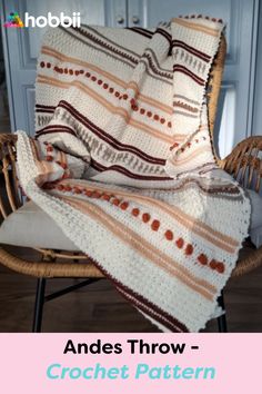 a crocheted blanket sitting on top of a chair