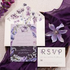 wedding stationery with purple and white flowers