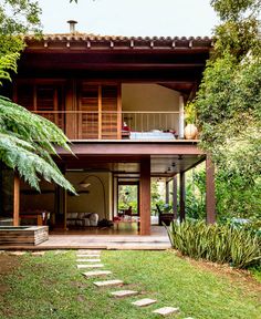 a house that is surrounded by trees and plants