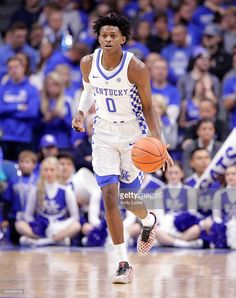 a basketball player dribbling the ball during a game