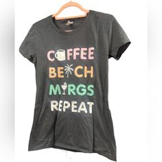 Brand New With Out Tags Graphic Tee Coffee Beach Marg Repeat Tee Size M Cery Soft Tee Black Short Sleeve Top For Beach Season, Trendy Black Tops For Beach Season, Trendy Black Top For Beach Season, Black Letter Print T-shirt For Beach Season, Black Text Print T-shirt For Vacation, Black Text Print Top For Vacation, Black Text Print Tops For Vacation, Black Crew Neck Top For Beach Season, Graphic Tee