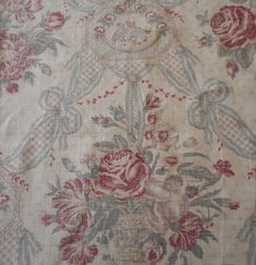 an old floral fabric with roses on it